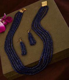 Natural Genuine Dark Blue Sapphire Beaded Necklace With Earrings NW : 600 carats GW : 625 carats No. Of Layers : 5 Model Image Necklace Length : 16-18 inches 1 gm 18k Gold Clasp Set in Sterling Silver 925 Non-Tarnishable Skin Tested 18k Gold Plated Clasp To Avoid Any Tarnishing Provided with GRS Lab Certification Real Time Image. No Tampering **Please note all the gemstones we use at RiyaJewels are completely natural , unheated and non-treated* Riya Jewels Has Set New Standards In Contemporary S Sapphire Beaded Rondelle Jewelry, Luxury Blue Rondelle Jewelry, Elegant Sapphire Round Bead Jewelry, Elegant Blue Jewelry With Faceted Beads, Elegant Sapphire Jewelry With Round Beads, Elegant Blue Faceted Beads, Elegant Sapphire Beaded Jewelry, Luxury Blue Jewelry With Polished Beads, Elegant Blue Polished Beads