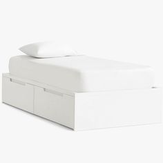 a white bed with two drawers underneath it