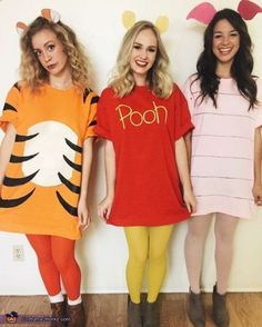 three girls dressed up as winnie the pooh and tigger from the disney movie