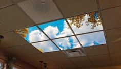 the sky is reflected in the windows on the ceiling