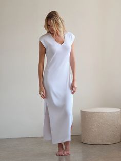 Our Supima Cotton Maxi Beach Dress is soft, comfortable, and durable, making it perfect for everyday wear. This dress’s indulgent use of luxury rib fabric means it floats on your body rather than hugging tight, making it ideal for a spring picnic or a breezy day at the beach. The Maxi Beach Dress can also be styled, with boots and a jacket, for a casual get-together with friends. The ribbed texture adds dimension with flexibility to the classic Maxi silhouette. Fitted V-neck Maxi Dress For Loungewear, Spring Maxi Dress For Lounging, Elegant Loungewear Dress With Side Slits, Chic Longline Maxi Dress For Loungewear, Spring Solid Midi Dress For Loungewear, Spring Solid Color Midi Loungewear Dress, Solid Color Midi Dress For Spring Loungewear, Spring V-neck Lounging Dress, Spring Casual Lounging Dresses