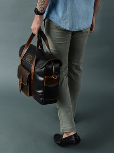 This Walker Office Top Handle bag is crafted with full-grain buffalo leather for a sophisticated, yet sturdy look. The adjustable strap ensures maximum comfort and convenience. Perfect for business professionals, it can fit laptops and documents plus all other essential office supplies. The Prestige Briefcase stands out from the competition with its unique colors and textures. Combining style with durability, this briefcase is the perfect choice for anyone looking for a distinctive yet reliable Essential Office Supplies, Office Top, Travel Tops, Office Travel, Business Professional, Buffalo Leather, Handle Bag, The Prestige, Leather Bags