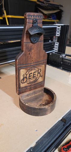 a wooden beer bottle holder sitting on top of a table