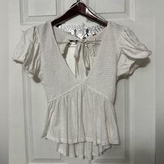 Free People Nwt Smocked Tie Back Size Medium Please Ask Any Questions At All White Top With Smocked Back For Brunch, White Smocked Back Top For Brunch, Summer Tops With Smocked Back And Short Sleeves, White Blouse With Smocked Back For Vacation, Chic Smocked Top With Short Sleeves For Vacation, Chic Smocked Short Sleeve Top For Vacation, Chic Short Sleeve Smocked Top For Vacation, White Smocked Bodice Blouse For The Beach, White Blouse With Smocked Bodice For Beach