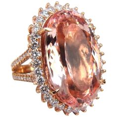 Split Shank Morganite Halo 33.18ct. Natural Orangy Pink Morganite & 3.00ct. diamonds ring. GIA Certified Report ID: 5161980467 27.46 X 16.63 X 11.14mm Full cut Oval brilliant Clean Clarity & Transparent 3.00ct. Diamonds. Rounds Full cuts G-color Vs-2 clarity. 18kt. rose gold 21.5 grams Ring Current size: 8 (Free Resize Service, Please inquire) Deck of Ring: 32.9 x 24mm Depth: 14mm $60,000 Appraisal Certificate to accompany & GIA Certificate. Heart Halo Ring, Morganite Diamond Ring, Diamond Rings With Price, Pink Diamond Ring, Fancy Yellow Diamond, Morganite Diamond, Ruby Diamond Rings, Modern Engagement Rings, Rose Orange