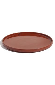 a brown plate on a white background