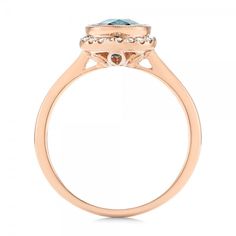 Rose Gold Diamond and London Blue Topaz Fashion Ring - Finger Through View Luxury Blue Topaz Halo Ring, Fine Jewelry Light Blue Sapphire Ring With Center Stone, Luxury Halo Topaz Ring, Luxury Light Blue Round Ring, Luxury Light Blue Round Rings, Elegant Light Blue Sapphire Ring With Center Stone, Elegant Light Blue Sapphire Ring, Light Blue Brilliant Cut Fine Jewelry Ring, Luxury Blue Topaz Ring With Center Stone