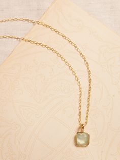 FACETED GEMSTONES: A tempting array of treasures, this collection pairs semi-precious gems with 22k gold-plated brass to highlight the stones' natural beauty and faceted cut.  Featuring brilliant labradorite, shimmering moonstone, and pearlescent prehnite.  A single stone pendant hangs from a gold-plated brass chain necklace.  Lobster clasp.  Length: 20" (51cm) Delicate Moonstone Gold Jewelry, Delicate Gold Moonstone Jewelry, Gold Square Pendant Jewelry With Pearl, Gold Square Pearl Pendant Jewelry, Yellow Gold Chalcedony Gemstone Necklace, Gold Chalcedony Jewelry As A Gift, Dainty Gold Moonstone Jewelry, Yellow Gold Chalcedony Jewelry Gift, Delicate Gold Necklace With Gemstone Accents