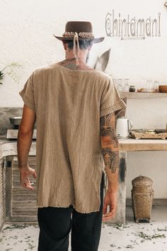 "Soft and very raw Man T-shirt with Diagonal Stripe is our new artifact. It is made of amazing hand woven cotton, very airy and soft artisanal fabric. Classic, simple silhouette will combine with trousers, shorts or jeans. Diagonal decorative stripe and raw, open bottom line create ultimate boho accent. This t-shirt comes in amazing, natural colors: simple black, desert sage, dusty pink and earthly terracotta. Perfect for warm climate or lazy hot summer day. Loose silhouette and 100% natural ver Boho Clothing Men, Mens Fashion Aesthetic, Hippie Tshirt, Boho Men Style, Bohemian Style Men, Desert Sage, Black Desert, Hippie T Shirts, Burning Man Outfits