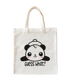 a panda bear tote bag with the words guess what? in black and white