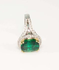 For Sale on 1stdibs - Elegant & Finely detailed Beautiful 7.90ct Cushion-cut Emerald Ring, surrounded by and accented on shoulders with a total of 56 round cut diamonds, weighing Green Diamond Pave Setting Jewelry, Green Diamond Jewelry With Pave Setting, Exquisite Green Jewelry With Pave Setting, Green Platinum Jewelry With Pave Setting, Exquisite Pave Setting Emerald Anniversary Ring, Dazzling Emerald Ring With Diamond Accent Stones, Dazzling Diamond Emerald Ring With Accent Stones, Formal Emerald Ring With Pave Diamond Setting, Formal Emerald Diamond Ring With Pave Setting