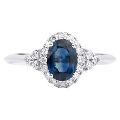 an oval blue sapphire and diamond ring