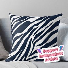 a pillow with the words support independent artists on it