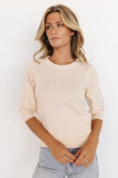 Feel and look your best in our Opal Knit Sweater that comes in Cream. This sweater is oh so cozy and would pair perfectly with jeans! Feminine Pointelle Knit Sweater For Fall, Feminine Long Sleeve Pointelle Knit Top, Feminine Long Sleeve Stretch Sweater, Chic Beige Knit Top With Ribbed Neckline, Chic Crew Neck Sweater With Ribbed Neckline, Chic Pointelle Knit Tops For Fall, Feminine Winter Knit Top, Beige Fitted Crew Neck Sweater, Feminine Long Sleeve Pointelle Knit Sweater