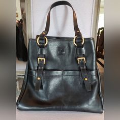 Dooney & Bourke Satchel/Tote Style Bag, Black, Florentine Leather, Large, Never Used, Excellent Condition, No Scratches. So Many Details Include: Two Outside Pockets With Closures, Satin Gold Metal Hardware, Magnetic Closure, Inside Pockets Include 2 Zipper Pockets, 3 Slip Pockets, Key Holder Clip, Opens Very Wide For Easy Access And Clips Closed To Make Profile Smaller/Tighter. Very Roomy, Gorgeous Florentine Leather, Longer Handles To Use Over Shoulder If Desired. Measurements 11.5" Tall, Appr Satchel Tote, Dooney & Bourke Bags, Overnight Bag, Metal Hardware, Key Holder, Dooney Bourke, Magnetic Closure, Easy Access, Inside Pocket