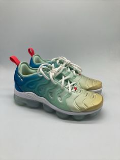 Elevate your sneaker game with these Nike Air VaporMax Plus in Mint Foam, Laser Blue, and Lime. The perfect addition to any women's athletic shoe collection, these sneakers are designed with a stylish and comfortable look in mind. Featuring the iconic Nike Air Vapormax Plus model, these shoes come in women's sizes 7.5-9.5 and are perfect for any occasion. The green colorway and sleek design make these shoes great for both casual and active wear. The brand's attention to detail and quality is evident in every aspect of the shoe, from the DQ7651-300 style code to the Nike Air VaporMax product line. Get ready to turn heads and feel amazing in these Nike Air VaporMax Plus sneakers. Air Vapormax Plus, Plus Model, Nike Air Vapormax Plus, Athletic Shoe, Air Vapormax, Sneaker Games, Womens Athletic Shoes, Nike Air Vapormax, Shoe Collection