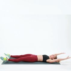 a woman is doing an exercise on a mat