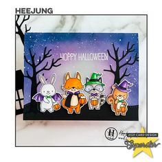 a card with three cute animals on it and the words happy halloween written in white