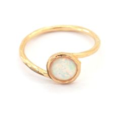 "Opal Ring, Opal Gold Ring, Opal Dainty Ring, White Opal Ring, Stacking Ring, Opal Gold Ring, Gold Ring, Opal Jewelry Gift for her, Gemstone Ring Dainty feminine Classic Opal Ring Details : ♥ Choose your size at \"size\" box ♥ Materials: 14 gold filled, lab opal ♥ matching earrings are available here: http://etsy.me/1NtMKtb ♥ White Opal ♥ stone it 6 mm in diameter ♥ 1 year guarantee ♥ Wrapped and ready to give, arrives in our signature Petite Delights by Ilona Rubin® Box.( we can add a personali Stackable Opal Promise Ring, Round Pink Opal Moonstone Ring Gift, Gold Opal Stackable Ring, Gold Stackable Opal Ring, White Opal Stackable Round Rings, White Opal Stackable Rings, Dainty Ethiopian Opal Ring, White Ethiopian Opal Ring For Promise, White Ethiopian Opal Promise Ring