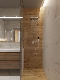 a modern bathroom with marble walls and flooring