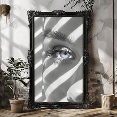 an image of a woman's blue eye reflected in a black frame on the wall