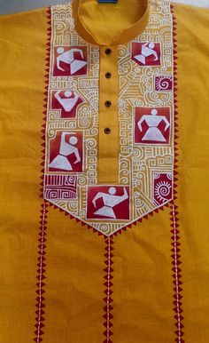 a yellow shirt with red and white designs on the front, along with an orange collar