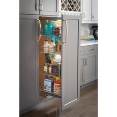 an open refrigerator door in a kitchen