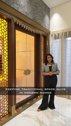 a woman standing in front of a glass window with the words keeping traditional space alive in modern homes