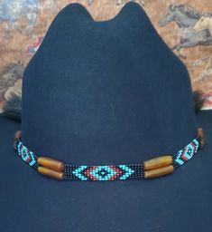 Adjustable Hat Band with GoldenAmber Horn Hairpipe Beads and Native American Indian Style Beading and 2 Tassels with a sliding knot that make this hatband a great fit for most hats. Available in Black or White Horse hair.  This stunning hat band is made from genuine braided horse hair and will compliment your favorite cowboy hat.   - Native American Indian style beadwork with GoldenAmber Horn Hairpipe Beads - Incudes 2 horse hair tassels that measure 3 1/4" long - Hat band measurements: approximately adjusts from  22" to 28" around and is approximately 1/4" inch wide - Hat bands are shown on a size 7 hat.  Hats are not included. - See my horse hair KEEPSAKES to have a hat band made from your horse's hair:  https://www.etsy.com/shop/BlueEyesDesignsHB?ref=seller-platform-mcnav§ion_id=4369774 Beaded Brown Hat Bands For Western-themed Events, Brown Beaded Hat Bands For Western-themed Events, Traditional Adjustable Hats With Bead Caps, Adjustable Hat Band With Bead Caps For Festival, Adjustable Bead Cap Hat Bands For Festival, Traditional Brown Beaded Hat Bands, Traditional Beaded Hat Bands For Rodeo, Traditional Beaded Hat Bands For Country Events, Bohemian Hat Band For Festivals