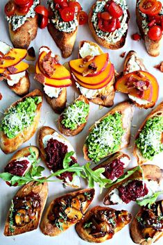 many different types of breads with toppings on them