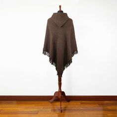 Introducing our exclusive unisex poncho, meticulously handcrafted from the finest llama wool yarn. This poncho is not just a garment; it's a blend of tradition and comfort. Its lightweight yet warm nature makes it an ideal choice for various settings. Key Features: Size: One Size, Approximately 48" Width x 43" Height / 122 cm Width x 110 cm Height, including fringe. Craftsmanship: Each poncho is a unique creation, handwoven by skilled indigenous artisans. Texture: soft to the touch, ensuring no Cozy Alpaca Poncho For Winter, Cozy Alpaca Cape For Winter, Winter Merino Wool Poncho, Cozy Cashmere Poncho For Winter, Cozy Cashmere Winter Poncho, Handwoven Winter Shawl Cape, Cozy Alpaca Poncho For Fall, Handwoven Shawl Cape For Winter, Handwoven Wool Poncho For Fall