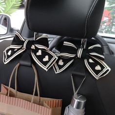 two bows tied to the back of a car seat