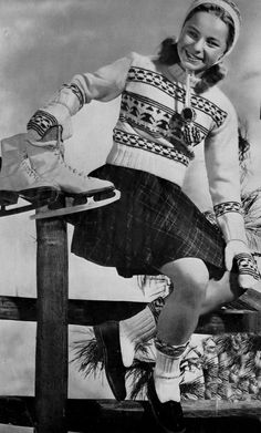 an old photo of a woman sitting on a bench with a skateboard in her hand