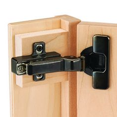 a close up of a wooden door with a black latch on the front and side