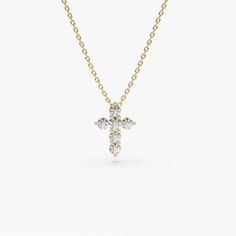 Gold KT: 14K Length & Width of Cross: 9.75x7.25MM Round Diamond: 6 pcs 2.0MM Total CTW: 0.21 Diamond Color-Clarity: G Color SI Clarity Setting Type: Prong A glimmering token of faith. 14k Gold Tiny cross showcases six stunning diamonds at the center of a thin gold chain. Diamond Cross Necklace Gold, Diamond Cross Necklace, Jewelry Cross, Tiny Cross, Diamond Cross Necklaces, Diamond Cross Pendants, Tiny Diamond, Diamond Cross, Handcrafted Necklace