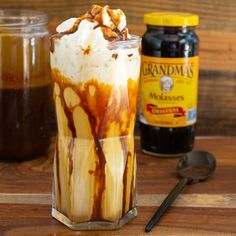 an iced drink with caramel and whipped cream