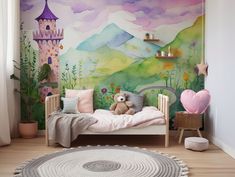 a child's bedroom with a mural on the wall