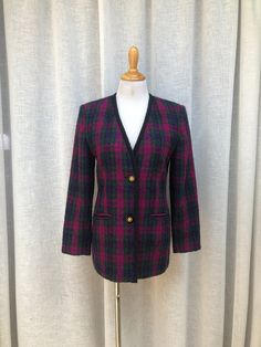 "This is a stunning rare vintage single breasted blazer by Lord & Taylor in green, purple/blue colors plaid with gold tone and black thread buttons, padded shoulders, two front pockets and black acetate lining.  Marked size 4P. Acrylic/Polyester blend. Perfect condition!  Measurements ( flat): Shoulder to shoulder: 16\" Armpit to armpit: 18\" Sleeve Length: 21\" waist: 34\" Shoulder to Hem: 27\"" Plaid Blazer With Buttons For Tailoring, Plaid Blazer With Buttons, Elegant Plaid Outerwear With Buttons, Elegant Plaid Tweed Jacket With Button Closure, Elegant Plaid Blazer With Buttons, Vintage Purple Blazer For Fall, Vintage Plaid Formal Outerwear, Classic Plaid Blazer With Buttons, Vintage Plaid Outerwear For Formal Occasions