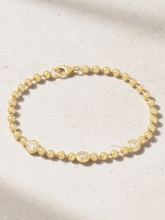 Gemella's 'Double Bubble' bracelet showcases the brand's affinity for timeless yet playful design. Crafted from 18-karat gold, it's made up of dainty beads and punctuated with glinting bezel-set diamonds. For maximum impact, pair yours with the coordinating necklace in our edit. Yellow Gold Bracelets With Single Cut Diamonds, Fine Jewelry Yellow Gold Chain Bracelet With Brilliant Cut, Luxury Diamond Bracelet With Bezel Setting For Everyday, Modern Gold Diamond Bracelet With Bezel Setting, Luxury Everyday Diamond Bracelet With Bezel Setting, Everyday Luxury Yellow Gold Bracelet With Single Cut Diamonds, Yellow Gold Brilliant Cut Chain Bracelet, Luxury Bracelets With Bezel Setting For Anniversary, Fine Jewelry Yellow Gold Diamond Jubilee Bracelet