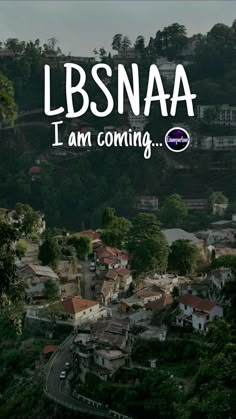 the words lbsnaa i am coming are in front of a small town