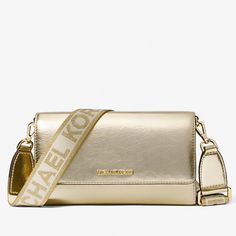 New With Tags 100% Authentic Michael Kors Jet Set Item Large Wallet Crossbody Metallic Pale Gold With Gold Tone Hardware Style # 35h3gttc7m Retail Price $398 Sporty Chic Meets Modern Minimalism On This Jet Set Crossbody Bag. It Opens To Reveal A Zip Compartment With Plenty Of Slip Pockets For Organizing Bills And Cards, While The Nylon Logo Strap Allows You To Convert The Leather Silhouette Into A Clutch. 55% Polyurethane/35% Polyester/10% Lurex Flap With Snap Closure Exterior Details: Back Slip Modern Gold Shoulder Bag With Logo, Gold Leather Bag With Logo, Gold Crossbody Bag With Logo, Gold Logo Crossbody Bag, Gold Crossbody Wallet For Evening, Classic Gold Crossbody Wallet, Michael Kors Gold Bag With Adjustable Strap, Gold Michael Kors Bag With Adjustable Strap, Everyday Gold Bags With Logo