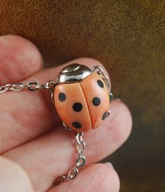 "I found this Orange Ladybug on silver plated in our Vintage Vault and couldn't believe it!   I have never seen this combination of orange and silver plated in a Vintage Ladybug before!!      Usually these ladybugs come in gold toned!!    These are the most ADORABLE necklaces ever!  These little Vintage ladybugs from the 1970's come in multiple colors and are just precious!  Nearly all cultures believe that a ladybug is LUCKY!  \"Ladybug Legends\" included with every purchase!  Get your Lucky La Ladybug Necklace, Marbled Resin, Bug Jewelry, Lucky Jewelry, Lucky Ladies, Real Vintage, Resin Necklace, Dream Jewelry, Jewelry Silver