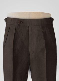 Pursue the subtly charming elegance with our Italian Prato Brown Linen Highland Trousers. Nevertheless, our trousers are made from a pure linen fabric which showcases a calm, uniformly smooth glance, including airy and supple textures making a brilliant choice for hot and humid climates. Besides, the cloth is covered with a solid finish over a brown hue, a dapper edge to the persona. Furthermore, complement the signature standout looks with detailed tailoring, which keeps things classic with premium fit, so make a great choice to stay cool at summer events on the horizon.  
 
 Look Includes   Italian     Prato Brown     Linen  Fabric  Cross Pocket  Forward 2 Pleats  Side Tabs (No Loops)- Arrow Shape  Bottom Cuff (1.5")  Two Welted Back Pockets on Trousers   Click 'Customize Now' to modify Tailored Linen Pants With Pockets, Classic Linen Pants With Pockets, Tailored Linen Long Pants, Elegant Flax Tapered Leg Pants, Classic Linen Pants With Welt Pockets, Classic Brown Linen Pants, Classic Brown Linen Bottoms, Classic Flax Trousers, Classic Tapered Leg Bottoms In Flax Color