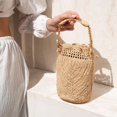 The Buckety collection is a celebration of artistry and sustainable fashion. Both timeless and versatile, the bucket shape makes it suitable for a wide range of occasions! The use of natural raffia, an eco-friendly and renewable material, ensures that this bag is not only a fashion statement but also an eco-conscious choice.  The bag's compact size is perfect for those who appreciate the charm of simplicity. It offers enough space to carry your essentials while maintaining an air of minimalism. Beige Bag, August Birthstone Jewelry, July Birthstone Jewelry, Heavy Rain, Gifts For New Mums, Jewelry Ring Box, Women Accessories Bags, Pearl Jewellery Earrings, Bag Handmade