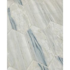 an image of marble flooring that looks like hexagonal tiles in white and blue