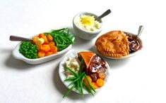 three small plates filled with different types of food