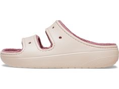 a child's white and pink shoe with two straps on the front, side view