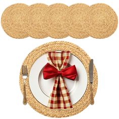 the place setting is ready to be served with red ribbon and matching placemats