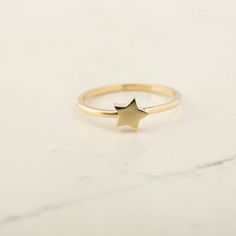 14K Solid Gold Star Ring - 14k Gold Small Astral Star Ring - 14k Gold Celestial Ring - 14k Gold Lucky Star Ring  14k Gold Star Stacking Ring ★★ Description ★★ Illuminate your style with our 14K Solid Gold Star Ring. Available in Gold, Rose Gold, and White Gold, this exquisite piece features a beautifully detailed star design measuring 6.4mm in both height and width. The delicate yet captivating star adds a touch of celestial elegance to your jewelry collection. Whether you wear it as a symbol of 14k Gold Star-shaped Celestial Rings, Star-shaped 14k Gold Stamped Ring, 14k Gold Celestial Star Ring, Celestial Star-shaped 14k Gold Rings, Star-shaped Yellow Gold Rings As Gifts, Star-shaped 14k Gold Promise Ring, 14k Gold Star-shaped Ring For Gift, 14k Yellow Gold Star-shaped Rings, 14k Gold Star-shaped Promise Ring