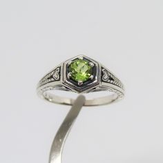 Vintage Sterling Silver Natural Peridot Filigree Ring ....Marked 925...Total of weights 2.9grams....Size 7....Measure of stone 5.1MM...It's in very good condition. Peridot Wedding Ring Silver, Silver And Green Ring, Classic Silver Peridot Rings, Classic Silver Ring With Peridot, Peridot Rings Stamped 925 For Anniversary, Heirloom Sterling Silver Green Ring, Classic Peridot Birthstone Ring, Green Sterling Silver Engraved Ring For Anniversary, Pretty Engagement Rings